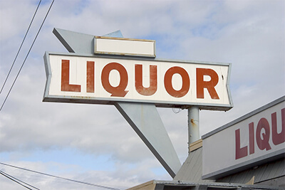 a liquor store sign in the 1950's style.